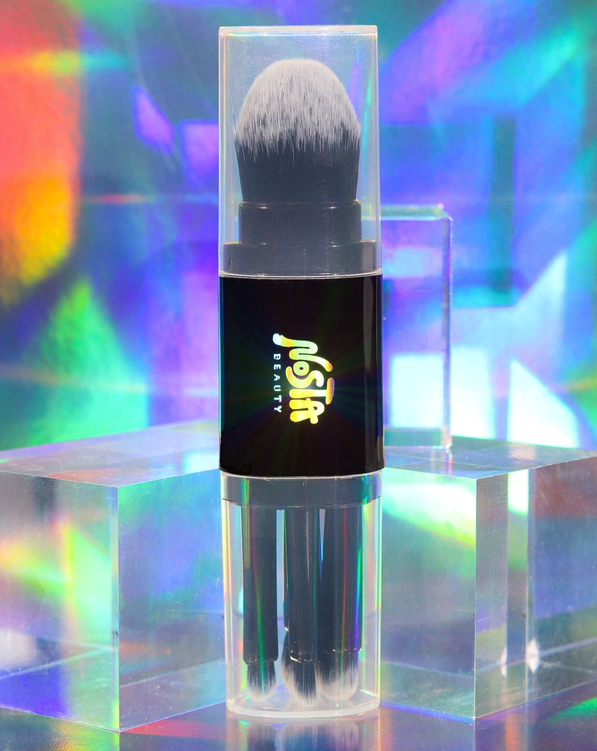 This is Nosta Beauty&#39;s all in one vegan makeup brush set with caps on, against a holographic background.